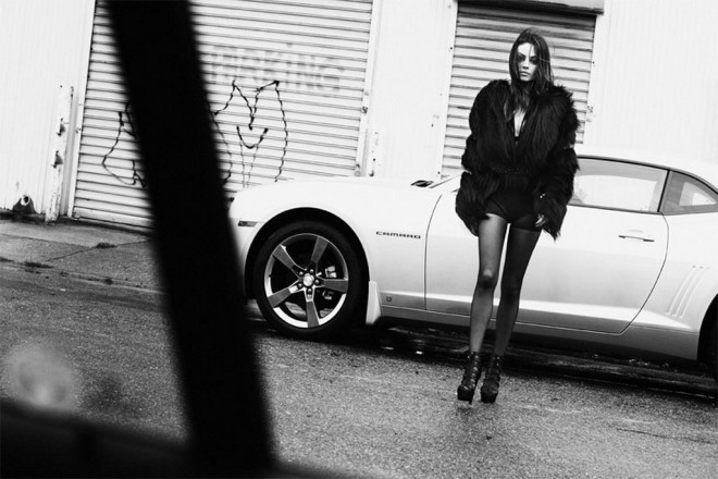 Mila Kunis with a Chevrolet Camaro